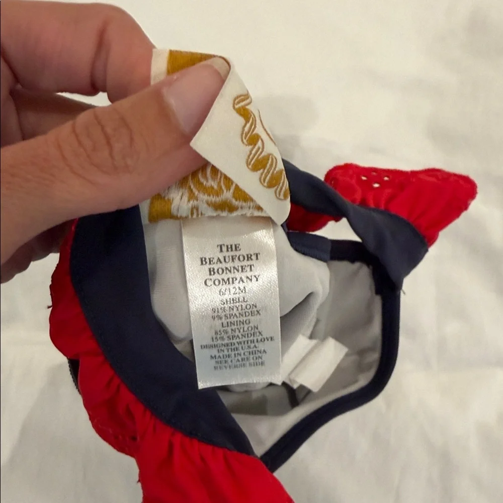 The Beaufort Bonnet Company Navy One-Piece Swimsuit with Red Ruffle Straps